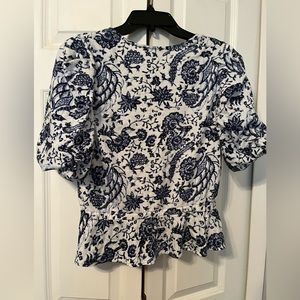 INC blue and white knit top.